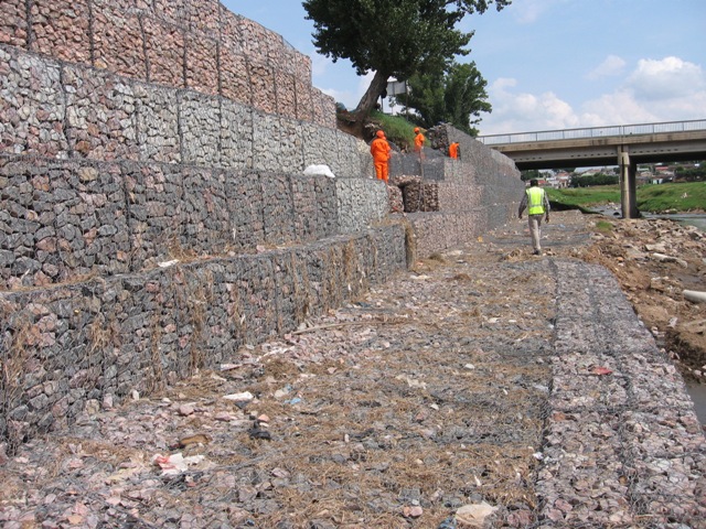 Gabions are cages filled with rock, concrete or sand and soil and are used for a variety of purposes. Based on their configuration, gabions can prevent erosion on steep slopes or control flow rates in channels. Gabions can be constructed into a variety of